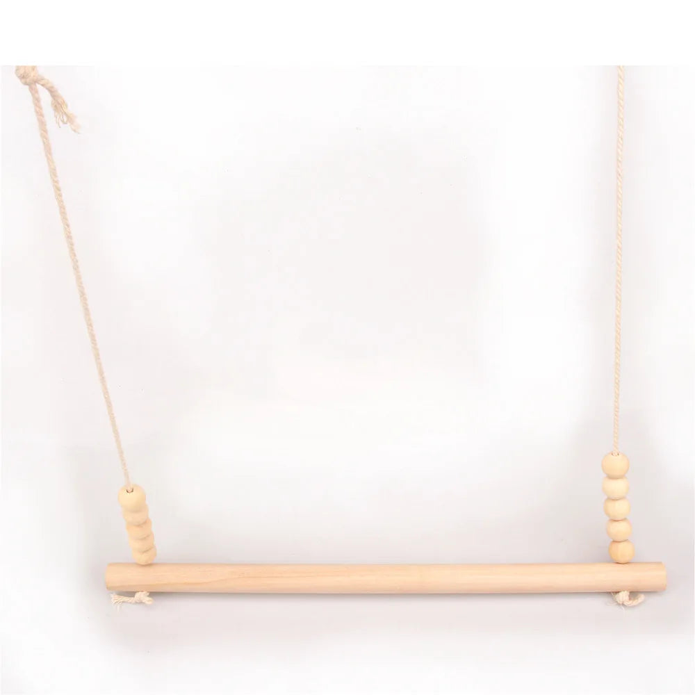 Wooden swing with beads on a white background